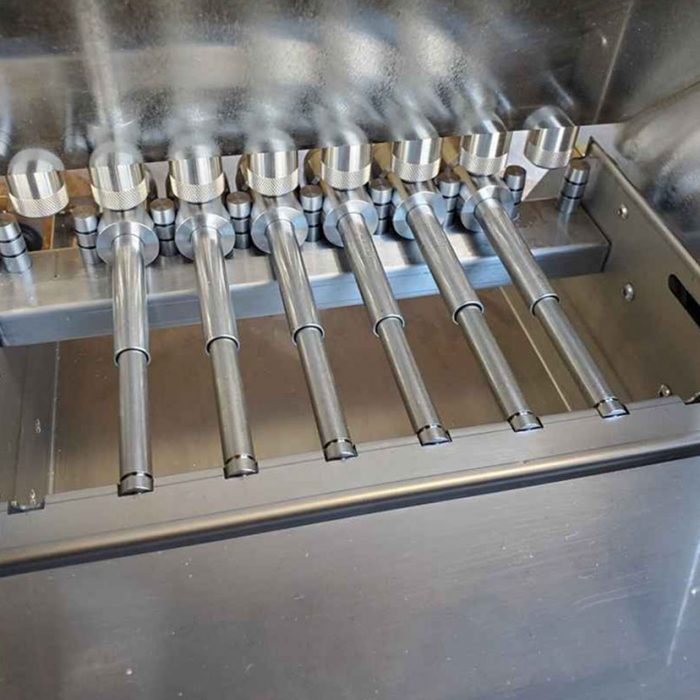 Piston sliding bar for universal depositor